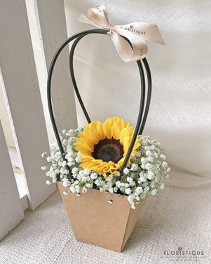 Sunset Flower Basket - Sunflower, Gossypium, And Baby's Breath Arranged By Florist In Singapore, Floristique