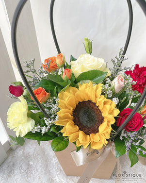 Clarabelle Flower Basket - Sunflower, Roses, Spray roses, Eustoma, And Carnations Comes With Flower Delivery Singapore Service